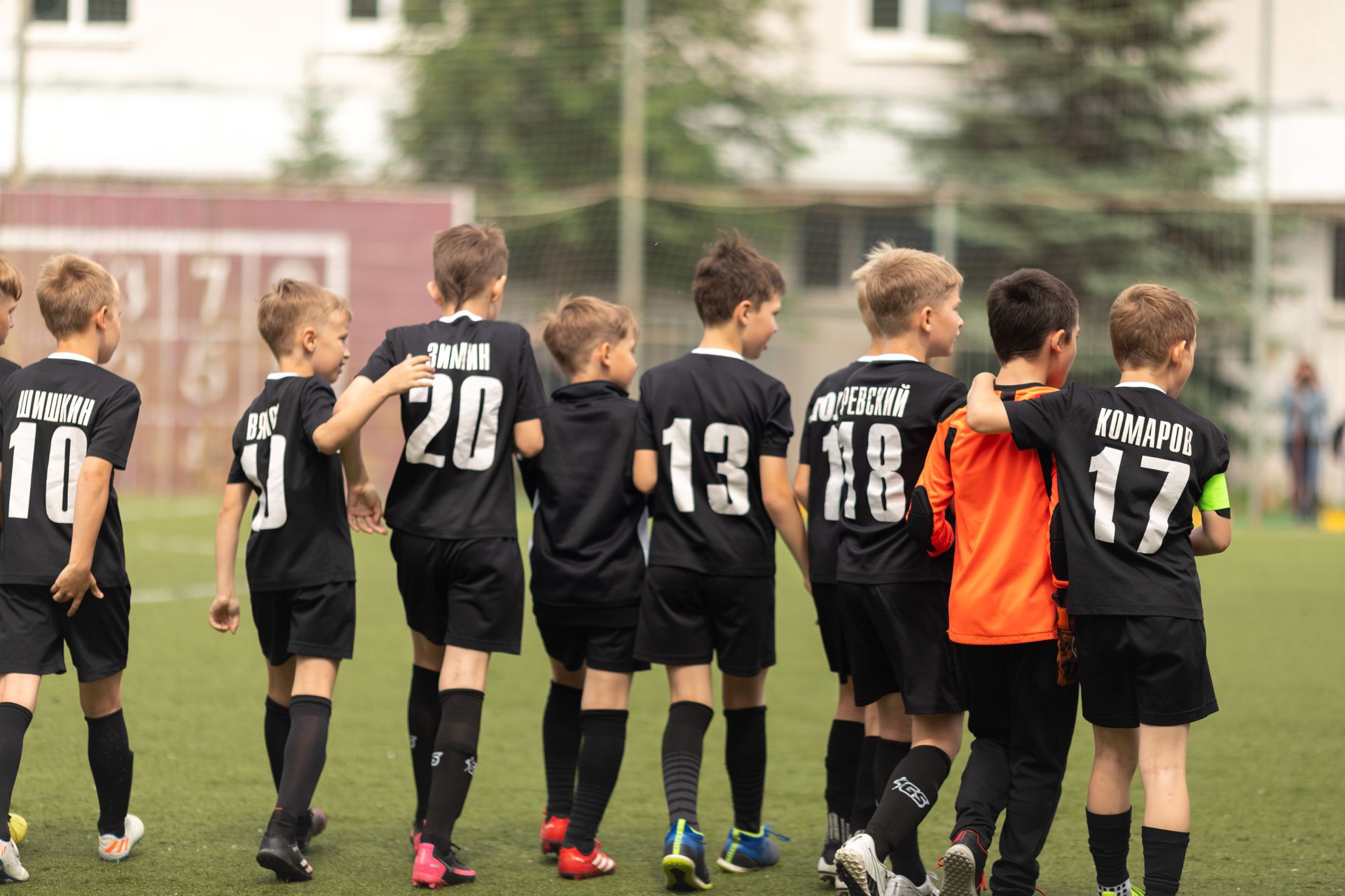 Youth team walking onto the pitch together
